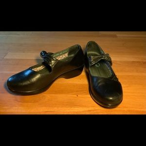 Dansko black clog with bow detail. Size 10.5. Excellent condition